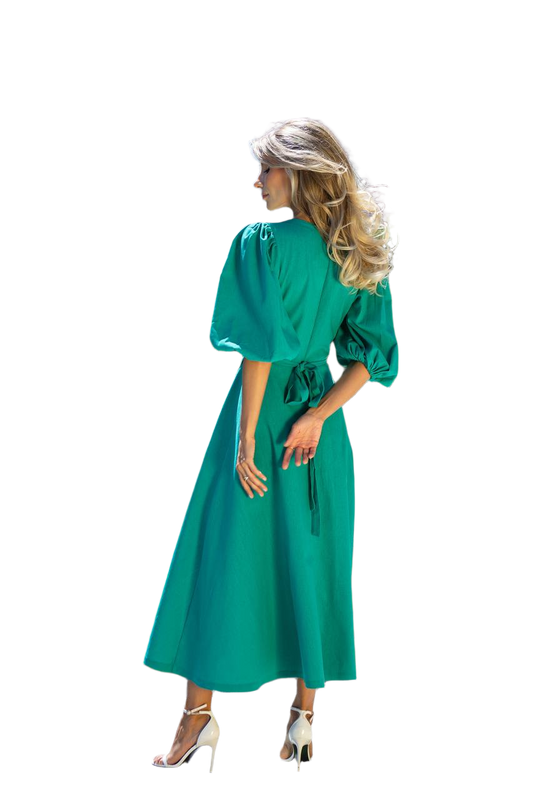 Woman wearing a green dress on a white background