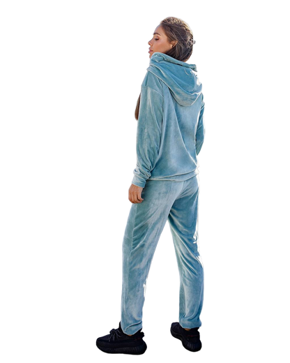 Person wearing a blue tracksuit on a white background