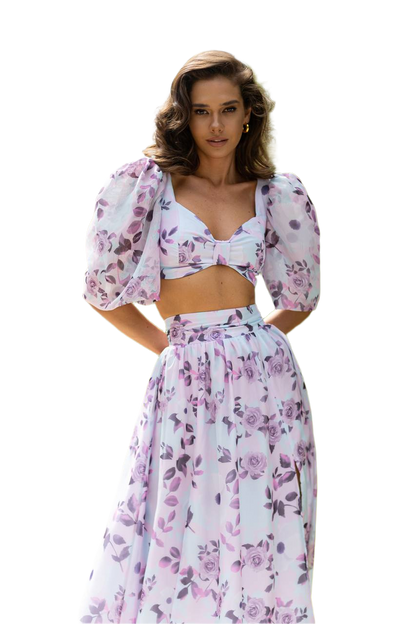 Woman wearing a floral two-piece outfit on a white background