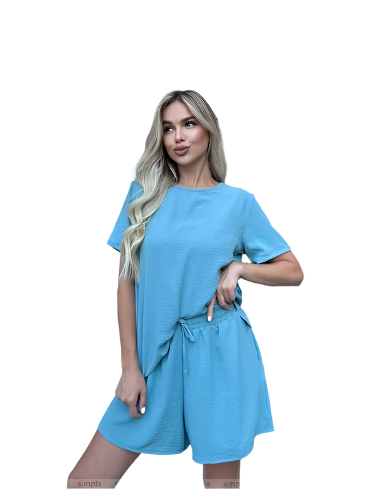 Woman wearing a blue dress on a white background
