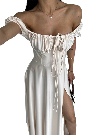 White off-shoulder dress with a heart-shaped cutout on a white background