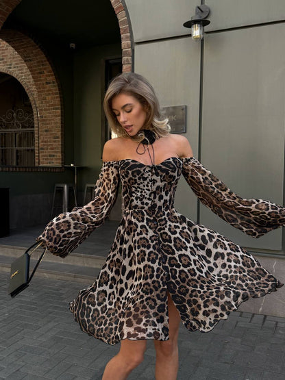 Woman wearing a leopard print dress in an urban setting