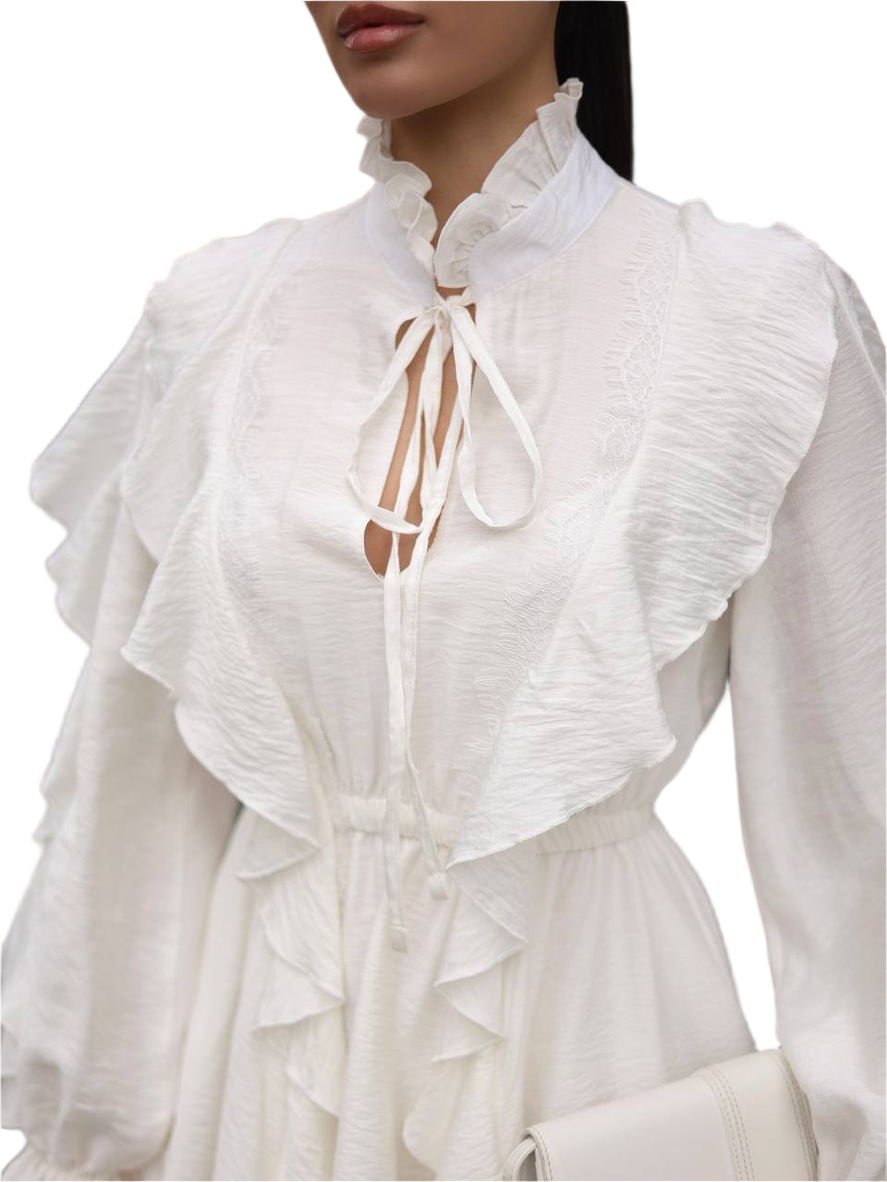 White blouse with ruffled details on a white background