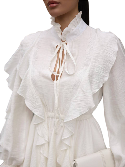 White blouse with ruffled details on a white background