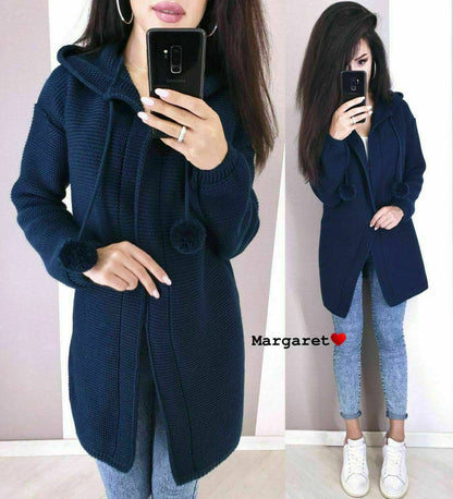 Woman wearing a navy blue coat with a white background