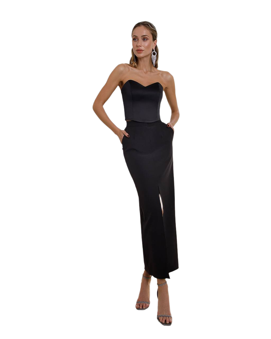 Woman wearing a black strapless gown on a white background