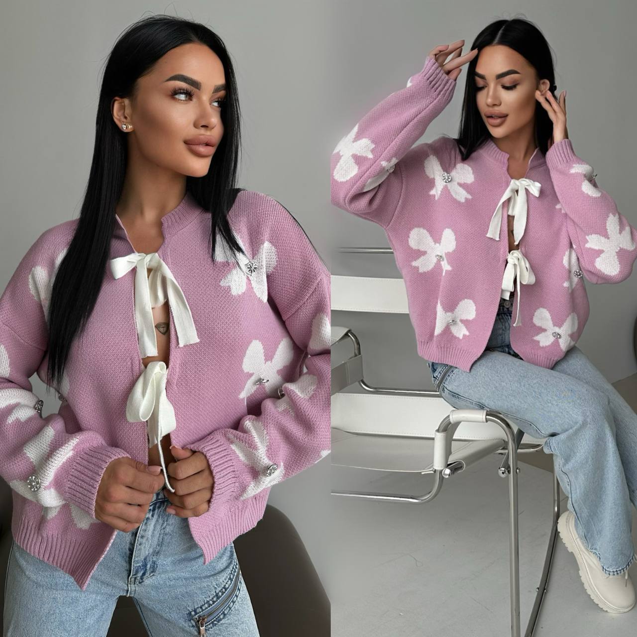 Woman wearing a pink cardigan with white bow details, sitting on a chair.