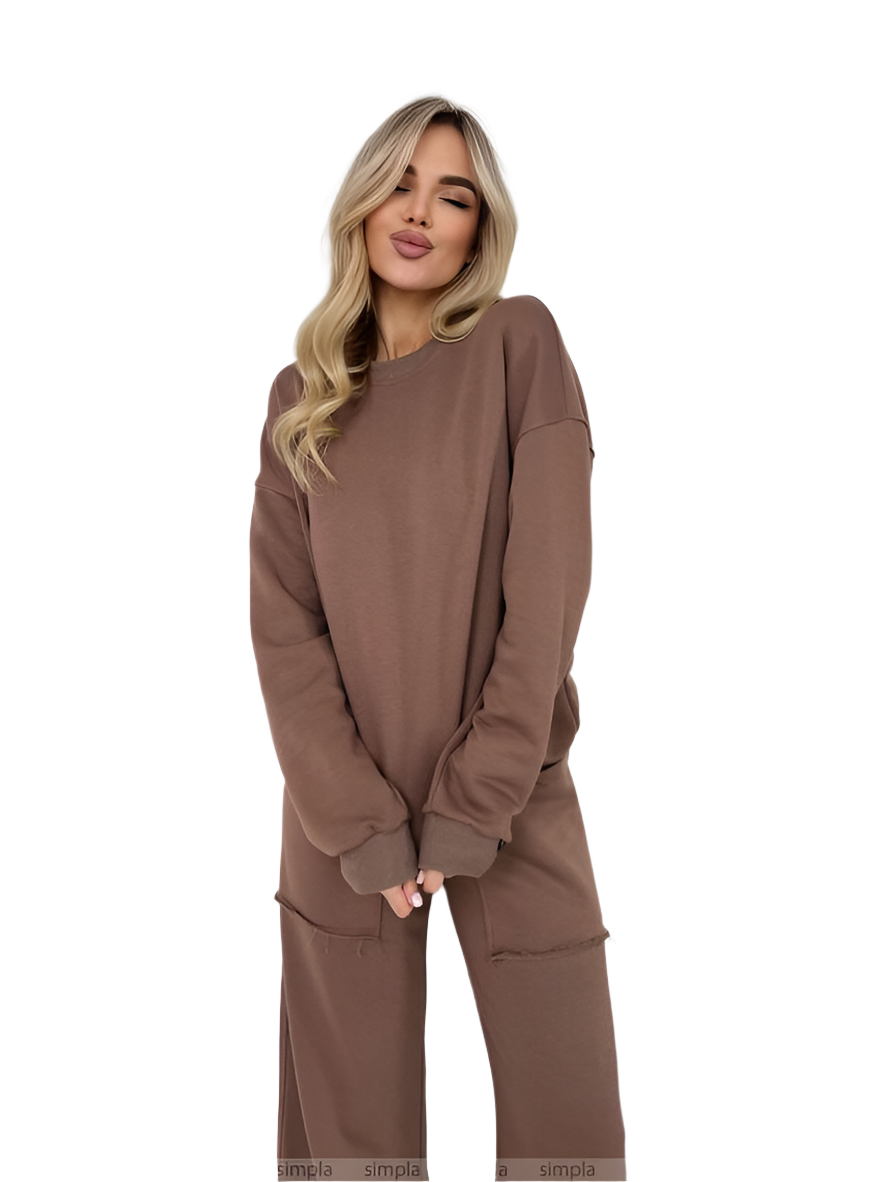 Woman wearing a brown sweatshirt and pants on a white background