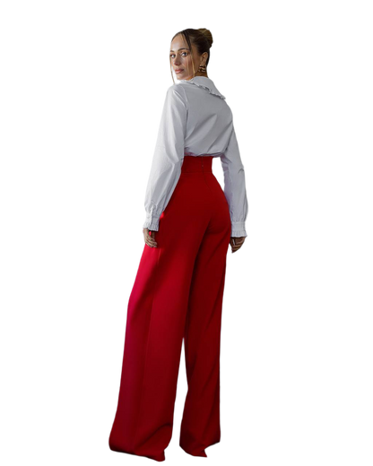 Person wearing a white shirt and red pants on a white background