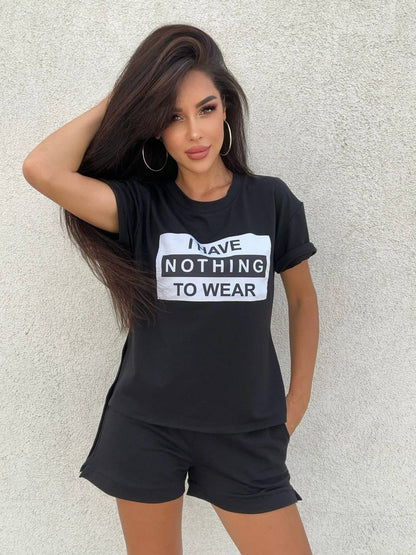 Woman wearing a black t-shirt with 'I Have Nothing to Wear' text against a light gray background