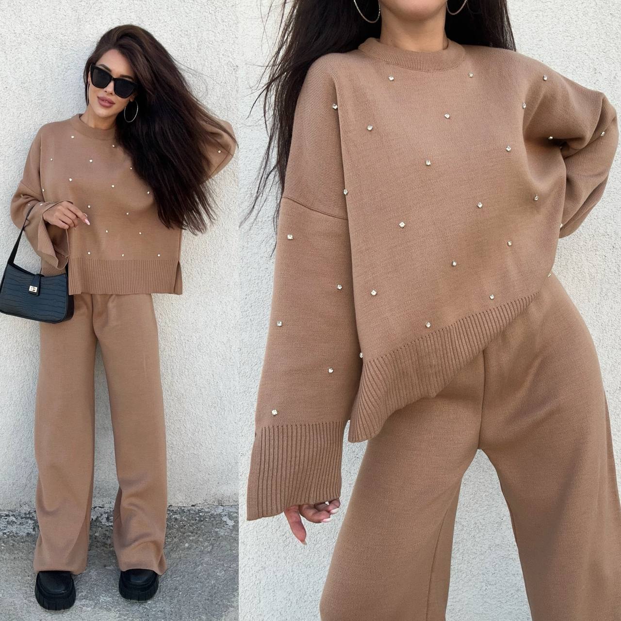 Woman wearing a brown outfit with pearl embellishments against a white wall.