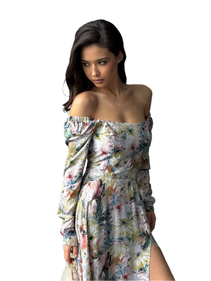 Woman wearing a floral off-shoulder dress on a white background