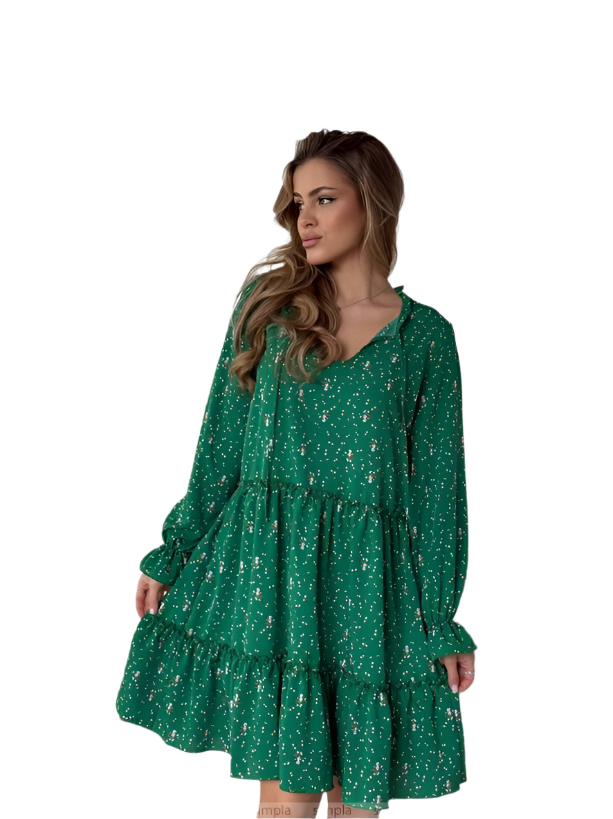 Woman wearing a green floral dress on a white background