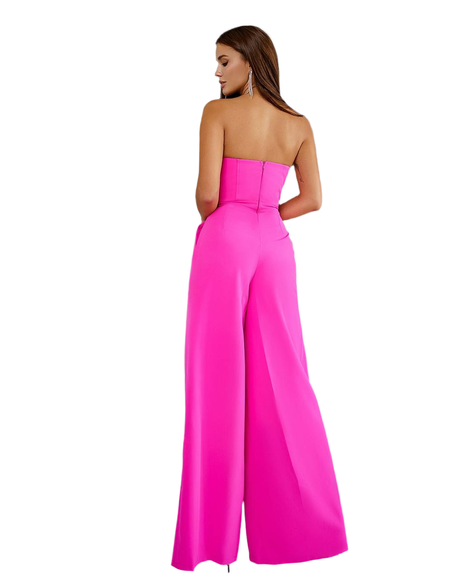 Woman wearing a strapless pink jumpsuit on a white background