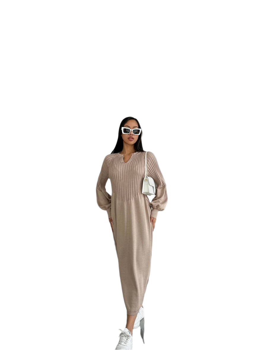 Woman wearing a beige ribbed dress with sunglasses and white sneakers on a white background
