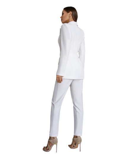 Woman wearing a white suit on a white background