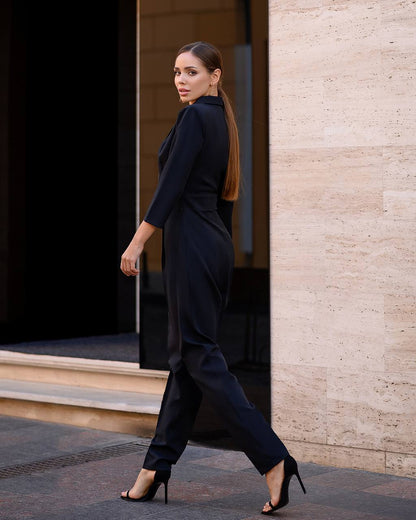 Woman in a black outfit walking out of a building