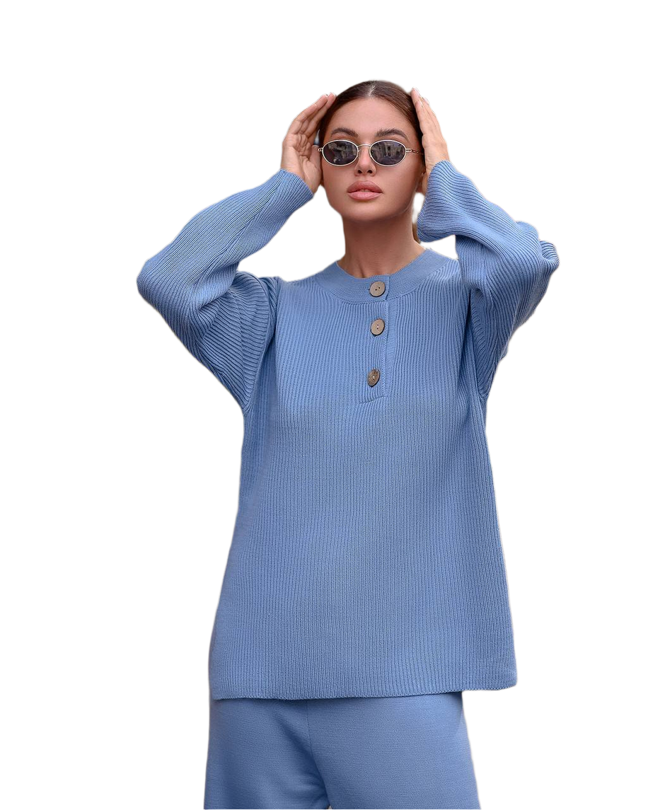 Woman wearing a blue outfit with sunglasses on a white background