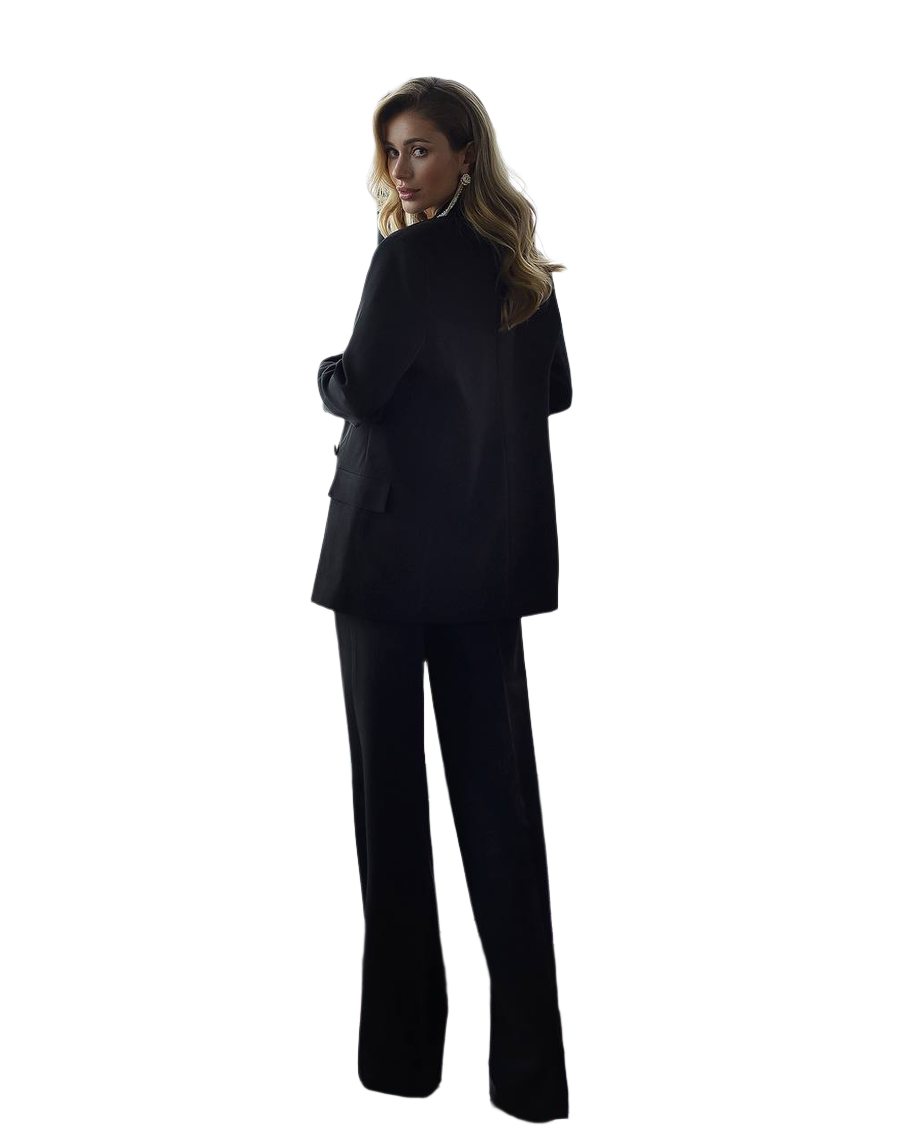 Person wearing a black suit on a white background