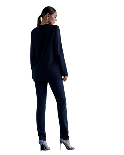 Woman wearing a navy suit on a white background