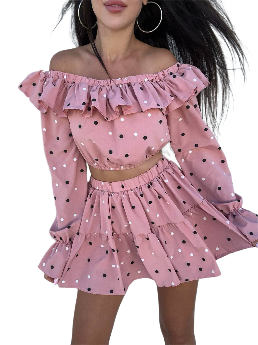 Pink polka dot off-shoulder top and skirt set on a white background