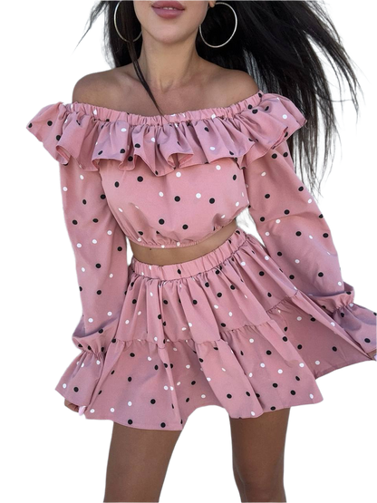 Pink polka dot off-shoulder top and skirt set on a white background