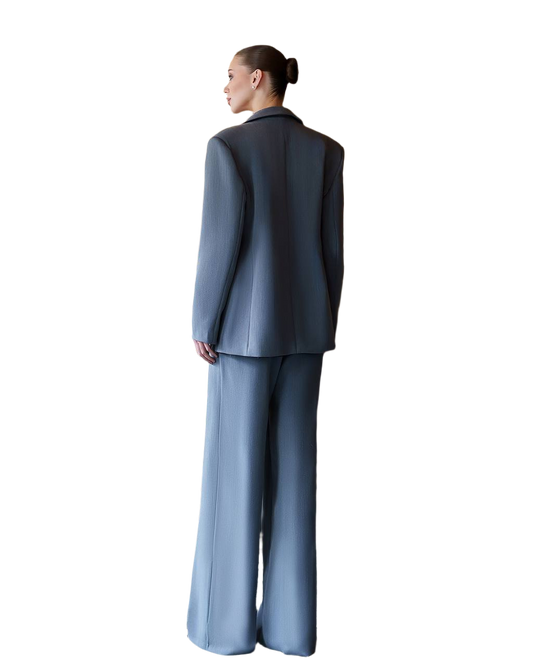 Person wearing a gray suit on a white background