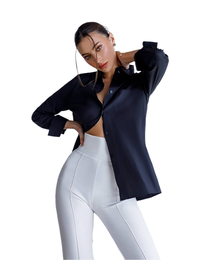 Woman wearing a black shirt and white pants on a white background