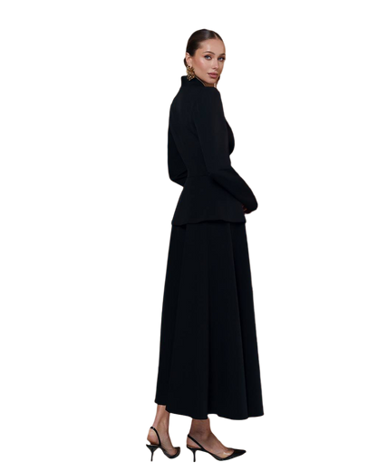 Woman wearing a black outfit on a white background