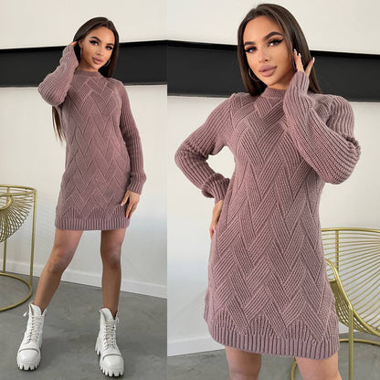 Woman wearing a pink knitted dress with white sneakers in a minimal indoor setting.