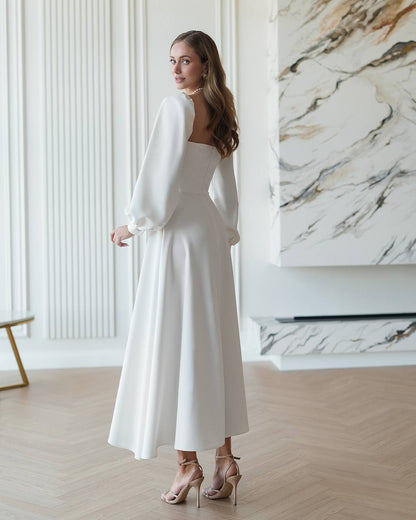 White Midi Dress with Cups and Long Puff Sleeves for Women