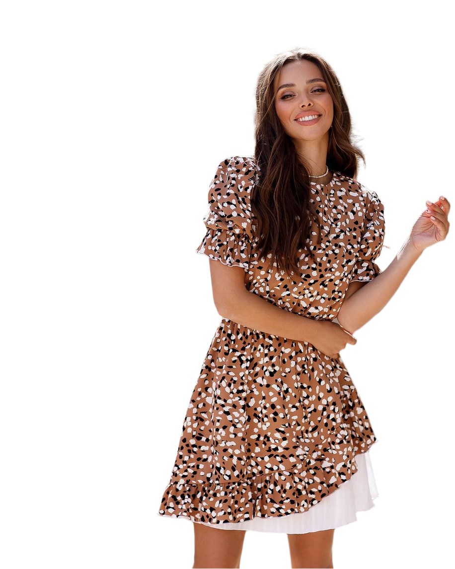 Woman wearing a patterned dress on a white background