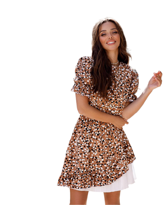 Woman wearing a patterned dress on a white background