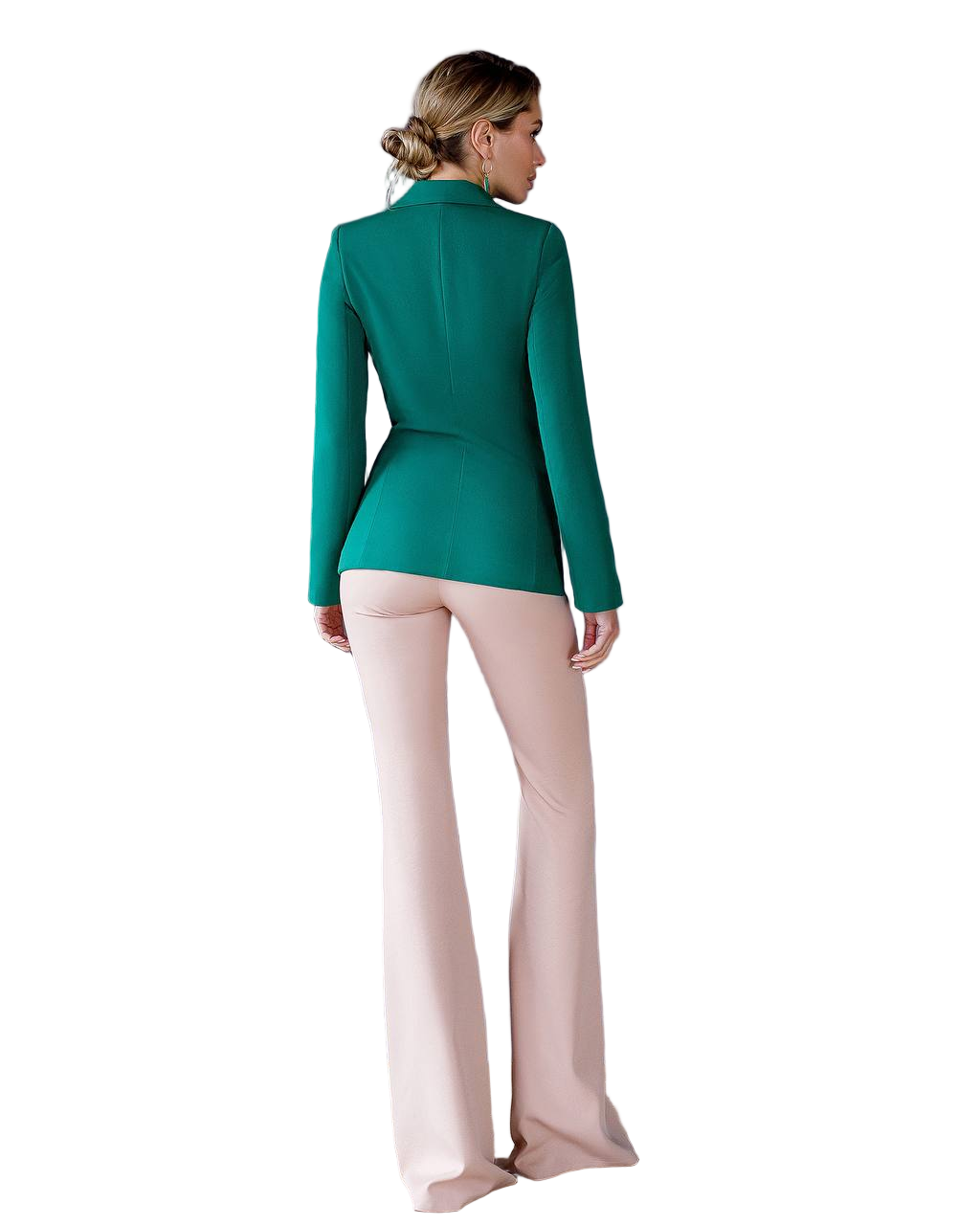 Woman wearing a green blazer and pink pants on a white background