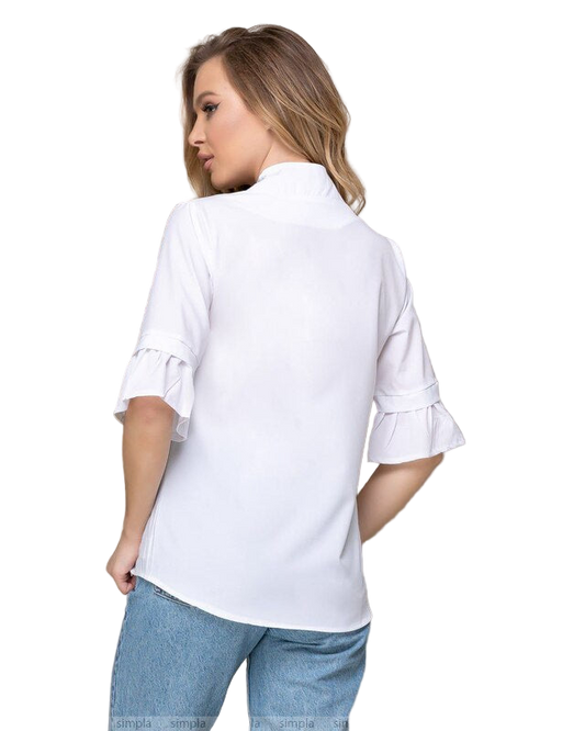 Woman wearing a white blouse with ruffled sleeves on a white background