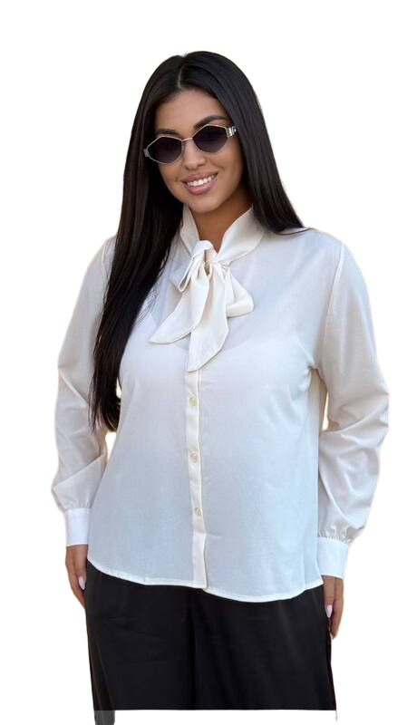 Woman wearing a white blouse with a bow tie and sunglasses on a white background