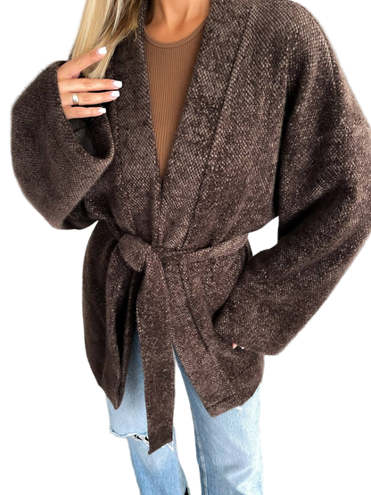 Brown belted cardigan worn by a person on a white background