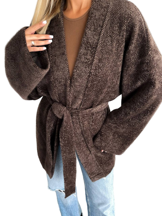 Brown belted cardigan worn by a person on a white background