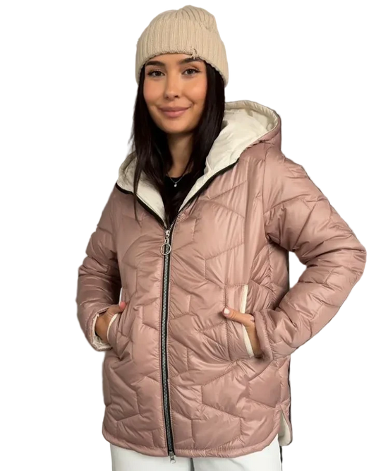 Person wearing a pink quilted jacket with a white hood on a white background