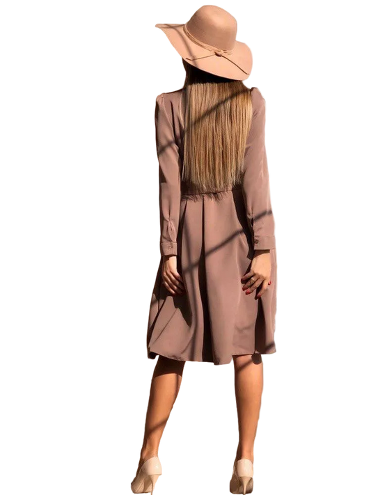 Person wearing a long-sleeve dress and wide-brimmed hat on a white background