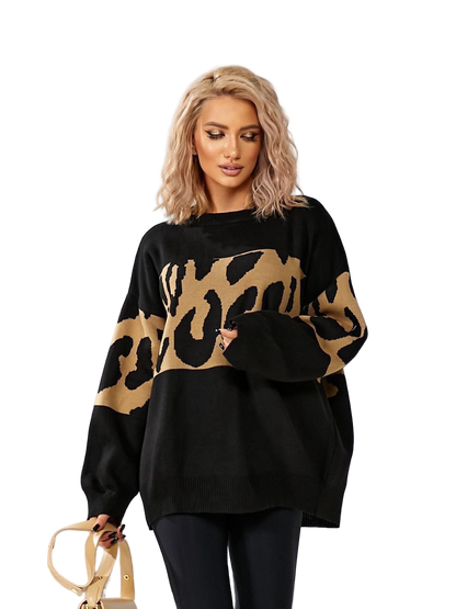 Woman wearing a black sweater with a gold leopard print pattern on a white background