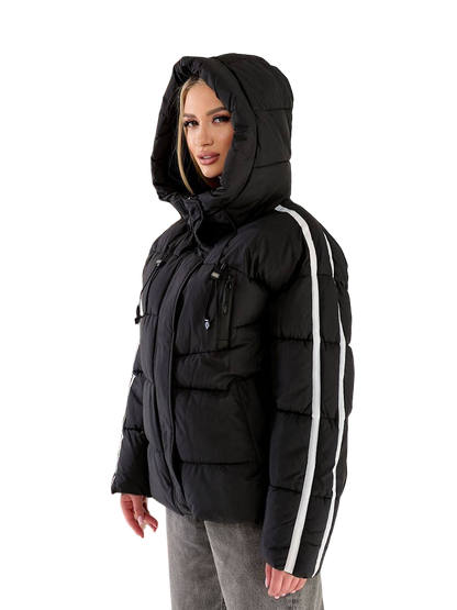 Person wearing a black puffer jacket with white stripes on a white background