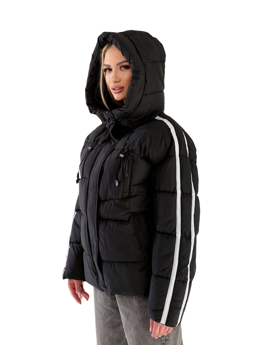 Person wearing a black puffer jacket with white stripes on a white background