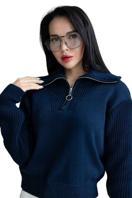 Woman wearing a blue sweater with a white background