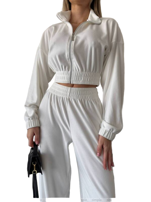 White tracksuit worn by a person on a white background