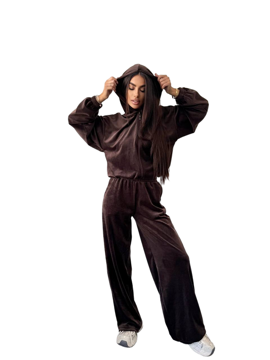 Person wearing a brown tracksuit on a white background
