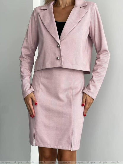 Pink suit with jacket and skirt on a gray background