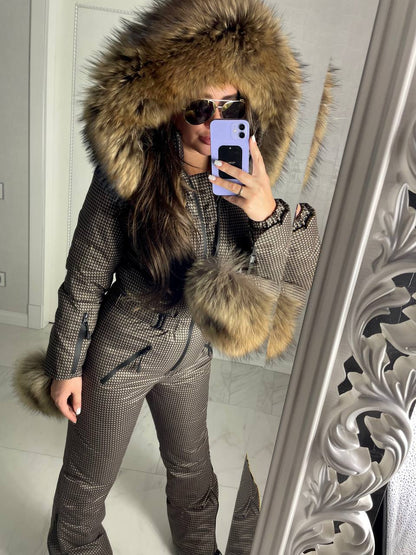 Person wearing a fur-lined hooded coat taking a mirror selfie.