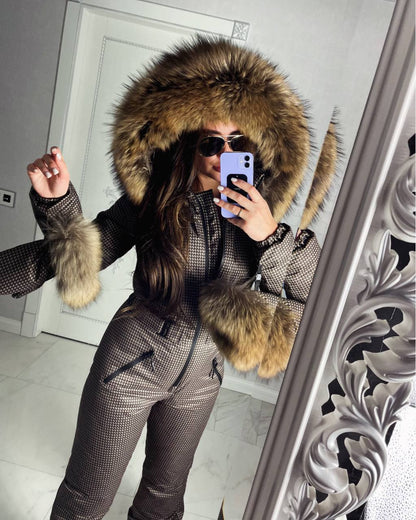 Person wearing a fur-lined hooded jacket taking a mirror selfie.