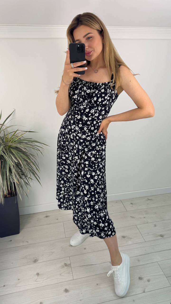 Black Midi Dress with White Floral Print, Elastic Straps, and Side Slit